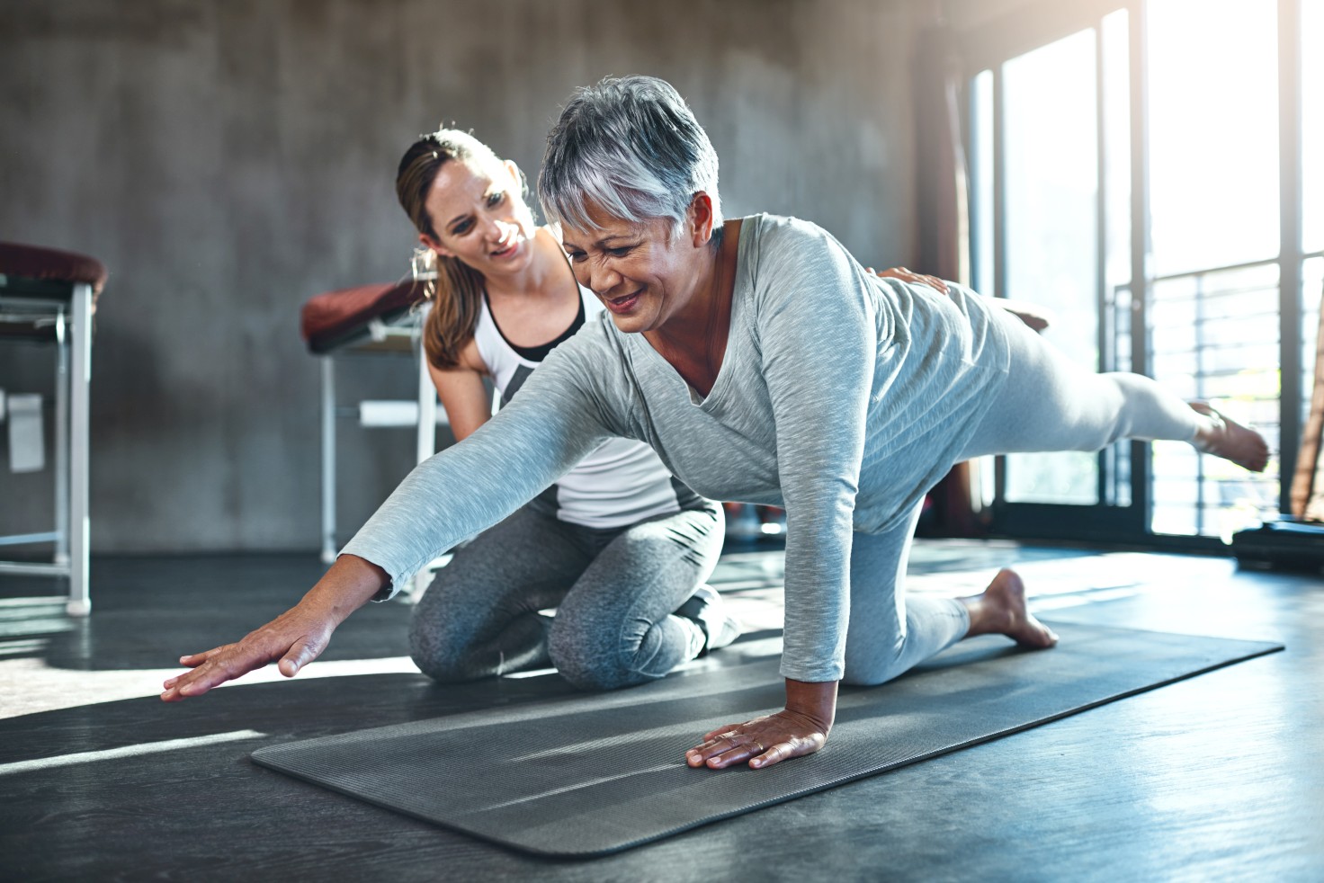 Shot of a senior woman working out with her physiotherapist.